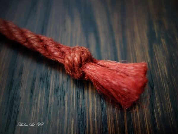 shibari rope in classic red by ShibariArt.PL - thistle knot ends
